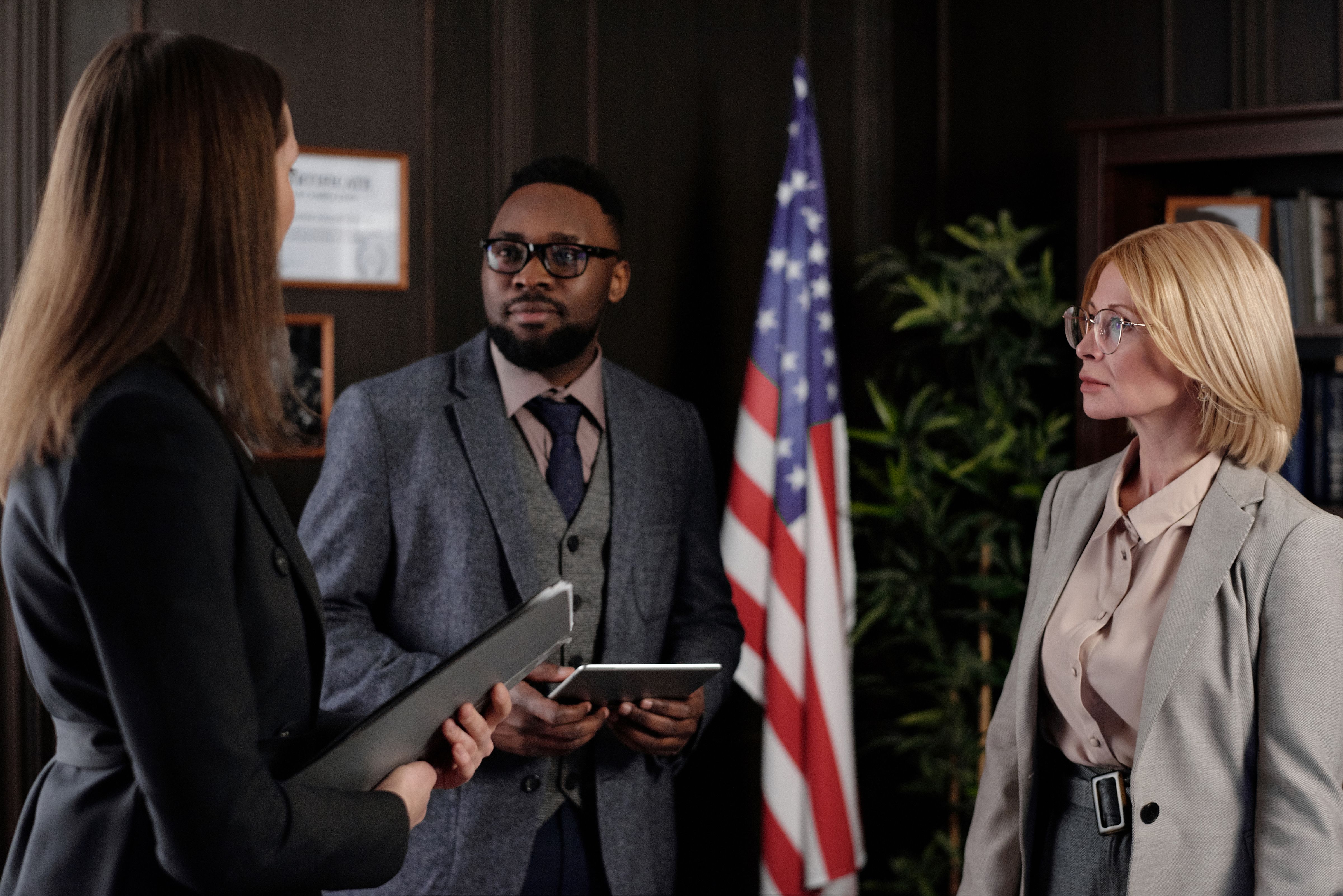 Attorney and client reviewing case strategy in a professional office