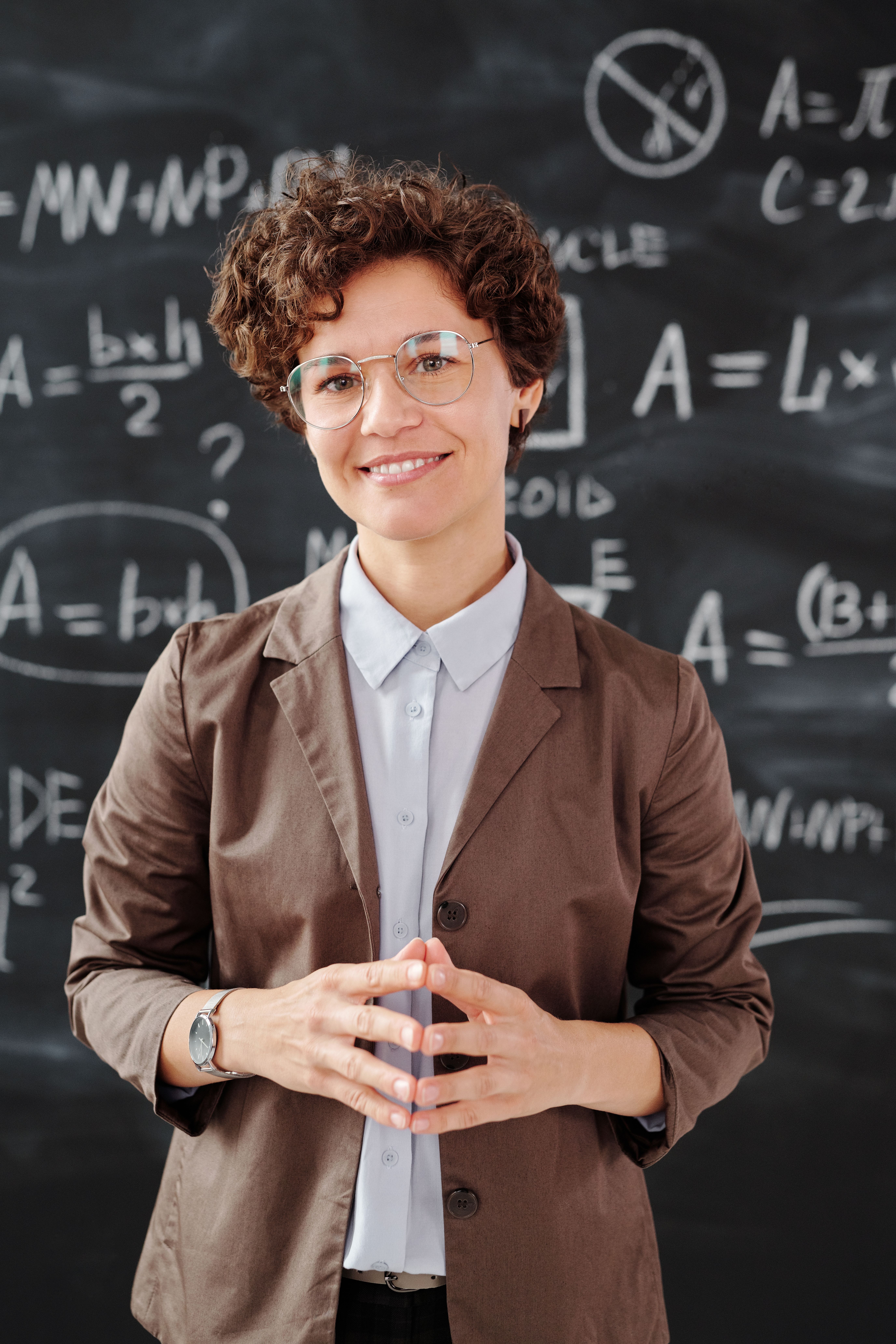 Instructor explaining material at a classroom whiteboard